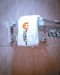 a towel hanging on a towel rack in a bathroom at Hadeb Property in Bukoba