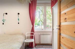 Rúm í herbergi á Cozy Apartment Praga