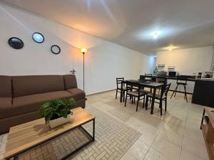 a living room with a couch and a table at Departamento Harmony Xalapa in Xalapa