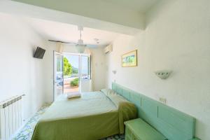 Postel nebo postele na pokoji v ubytování Hotel Parco Cartaromana