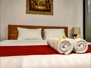 Een bed of bedden in een kamer bij Griya Umadui Bali
