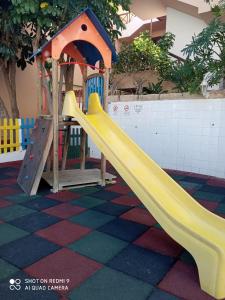 a playground with a slide in a building at Las Meninas Tenerife in San Miguel de Abona