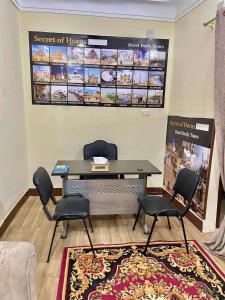 a meeting room with a table and chairs and a sign at Secret of Horus in Cairo