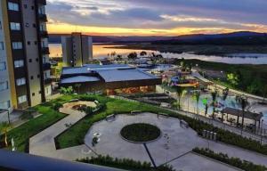 a view of a resort with a pool and a park at Prive Praias do Lago Eco Resort in Caldas Novas