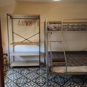 two bunk beds in a room with a tile floor at Casa Pp in Finestrat +17 photos