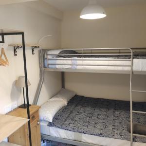 a dorm room with two bunk beds in it at Casa Pp in Finestrat