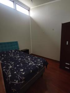 En eller flere senge i et værelse på ICARUMBI