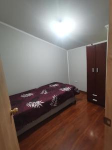 En eller flere senge i et værelse på ICARUMBI