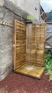 a wooden privacy fence on the side of a building at Los Huertos Conect with the nature & relax in Icod de los Vinos