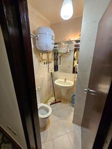a bathroom with a toilet and a sink at Porto Sokhna Water Front For Familis in Ain Sokhna