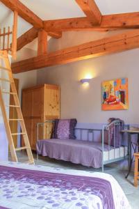 a bedroom with a bunk bed and a ladder at Chambres d'Hôtes Carpe Diem in Callian