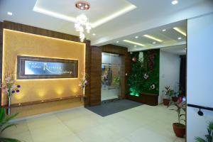 a lobby with a store front with flowers and plants at Hotel Royal Residency in Vadodara