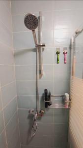 a shower with a shower head in a bathroom at Beautiful house in the old town of Chania- 4 rooms in Chania Town +39 photos