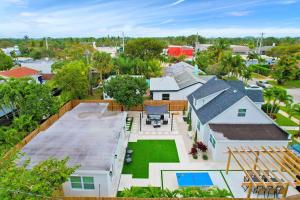 an aerial view of a house with a yard at Lytle Palm Studio in West Palm Beach
