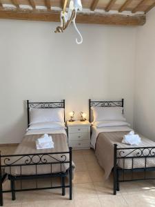 A bed or beds in a room at B&B I Giardini
