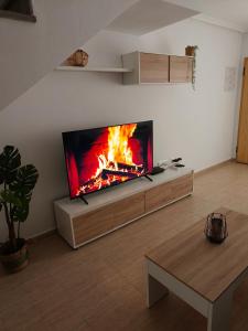 a living room with a fireplace in the wall at Casa Trastévere in San Juan de los Terreros