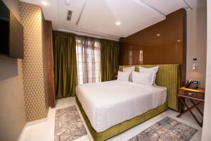 MAGNIFIQUE HOTEL客房内的一张或多张床位