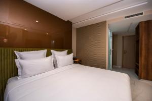 MAGNIFIQUE HOTEL客房内的一张或多张床位