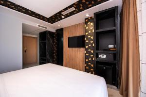MAGNIFIQUE HOTEL客房内的一张或多张床位