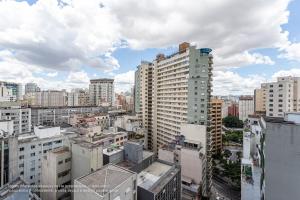 a view of a city with tall buildings at Setin Downtown Genebra by Viva - Apartamentos completos na Bela Vista com piscina in São Paulo +15 photos