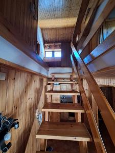 an empty sauna with wooden walls and wooden stairs at Delizioso appartamento in centro a Champoluc in Champoluc
