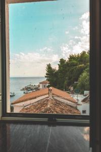 a view of the ocean from a window at Room with amazing sea view in Himare
