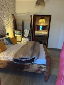 a bedroom with a wooden bed in a room at Villa tangawizi kendwa in Kendwa