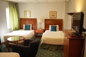 Postel nebo postele na pokoji v ubytování Conord Hotel