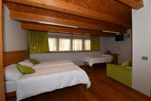 Postel nebo postele na pokoji v ubytování Agritur Anselmi