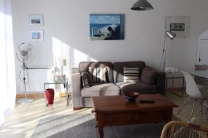 a living room with a couch and a coffee table at BOKATEA in Cambo-les-Bains