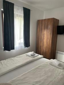 Postel nebo postele na pokoji v ubytování Vila Bosa - Stara planina