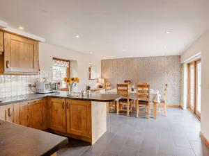 a kitchen and dining room with a table and chairs at 3 Bed in Launceston BRWHI in Launceston