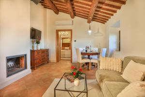 a living room with a couch and a table at Pietra Campana Italian Villa Orvieto in Orvieto