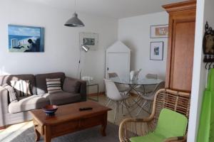 a living room with a couch and a table at BOKATEA in Cambo-les-Bains