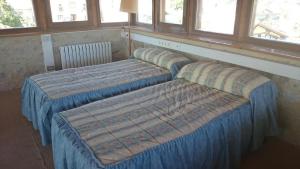 Cama o camas de una habitación en Casa Torre Cantoblanco