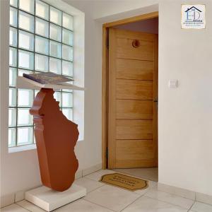 a vase sitting on a shelf next to a door at E&D Apartments in Antananarivo