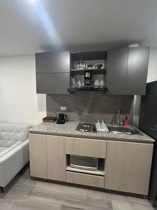 a small kitchen with a sink and a sink at • POWER STYLE • Apto con terraza in Bogotá +13 photos