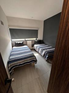 - une chambre avec 2 lits dans l'établissement Casa entera Morelia, hospitales, corporativos 2, à Morelia