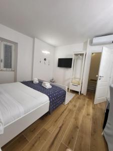 Llit o llits en una habitació de Affittacamere Il Timone