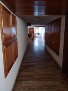 an empty hallway of a building with wooden cabinets at NIDO ALPINO in Sestriere