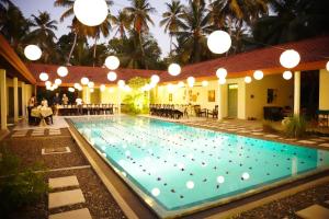 a large swimming pool with lights above it at Villa Blue Lotus Katunayake in Katunayake