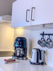 a kitchen counter with a toaster and a coffee maker at Enjoy Reykjavík Yellow Door Apartment in Reykjavík