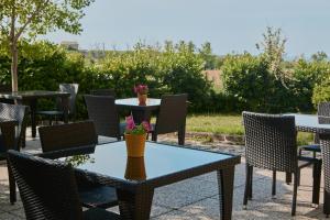 a group of tables and chairs on a patio at Villa Marianna in Vasto