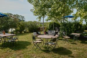 a group of tables and chairs in the grass at Villa Marianna in Vasto