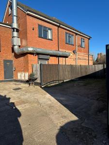 a pipe on the side of a brick building at Large 7 Bedrooms split-level Flat Sleeps up to 14 in Birmingham