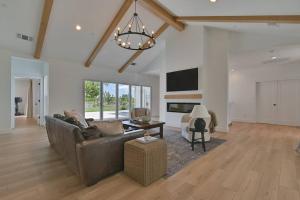 a living room with a couch and a table at The Modern Farmhouse in Yuba City