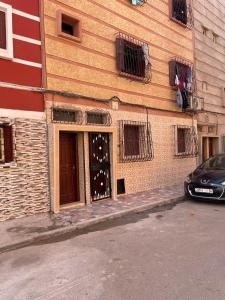 a car parked in front of a building at Fully equipped ground floor apartment in Safi