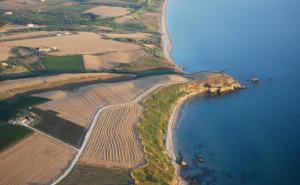 an aerial view of a farm field and the ocean at Villa Marianna in Vasto