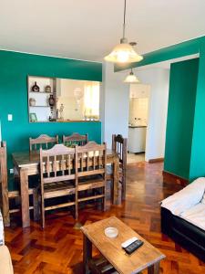 a living room with a table and a dining room at Departamento Centrico in Mendoza