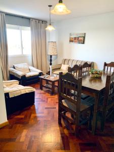 a living room with a table and a couch at Departamento Centrico in Mendoza